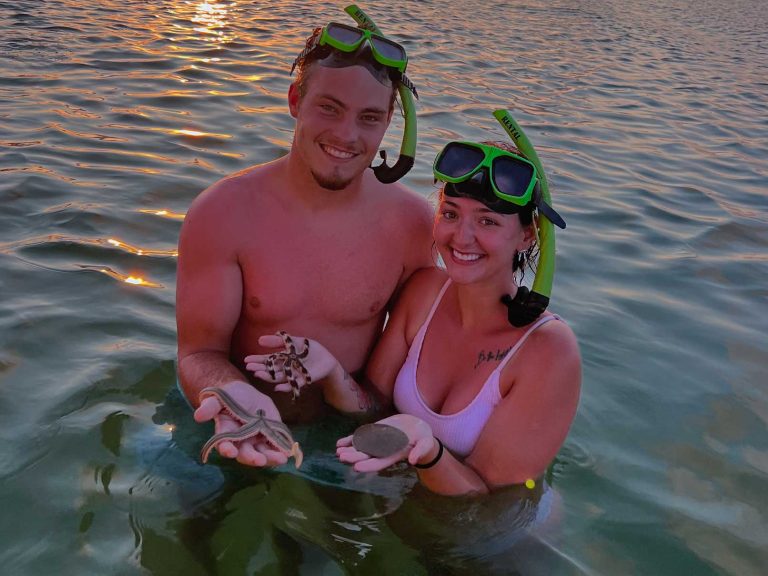 3 Hour Shell Island Private Tour 2 couple with sand dollars